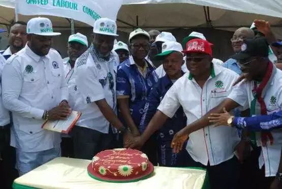 United labour congress members cutting the annivesary cake