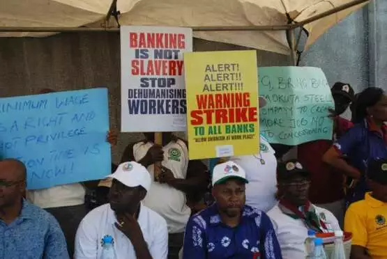 workers displaying placards