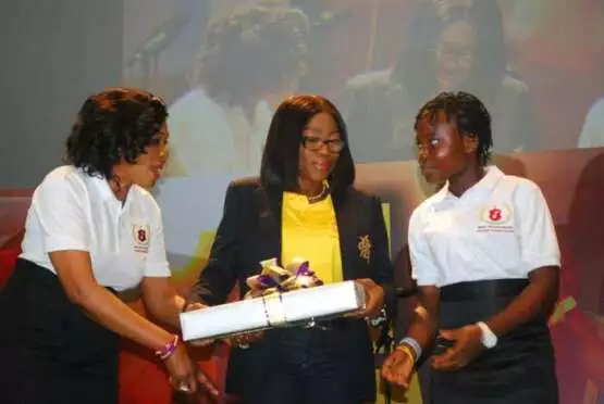 Mrs Bolanle Ambode, presenting a gift to one of the beneficiary,flanked by Senator Oluremi Tinubu