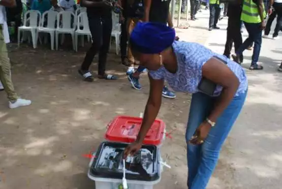 A voter casting her vote