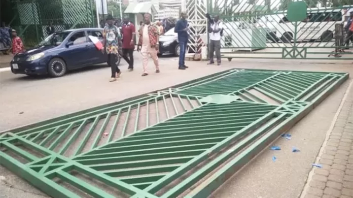 NLC Pulls Down National Assembly Gate in Abuja