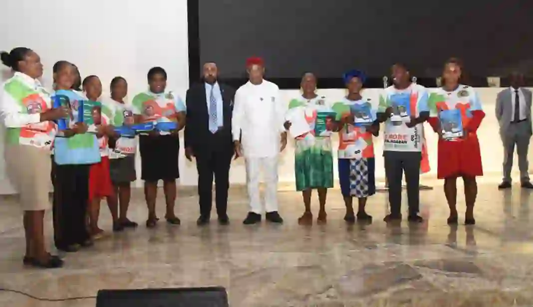 Gov Uzodimma, Professor Ikegwuoha and some of the beneficiaries with their computer tablets.